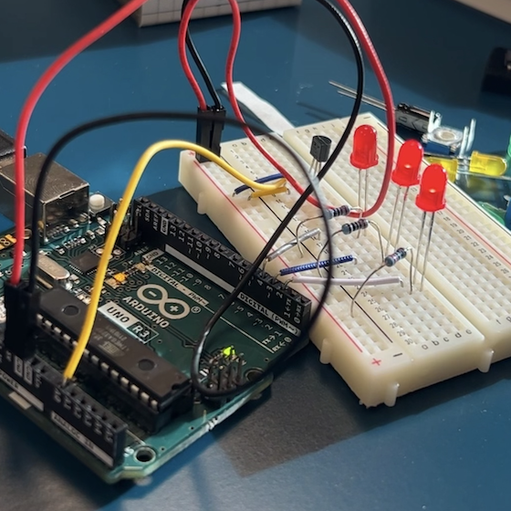 A picture of an Arduino, used to background the page's description